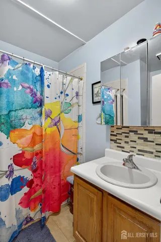 a view of a balcony with wooden floor and fence