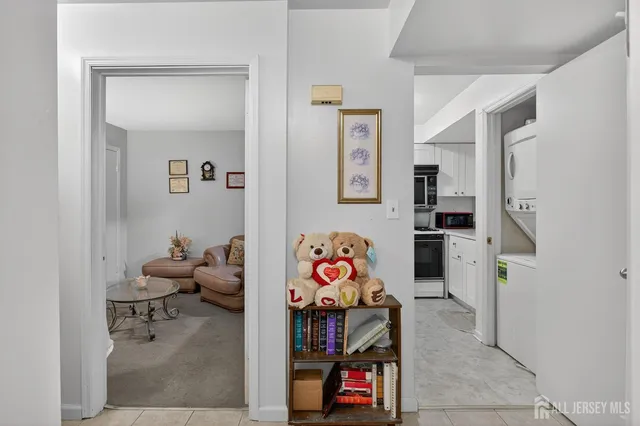 a kitchen with stainless steel appliances a sink a stove a microwave a refrigerator and cabinets