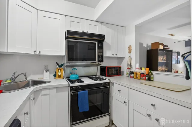 a kitchen with a stove and a microwave