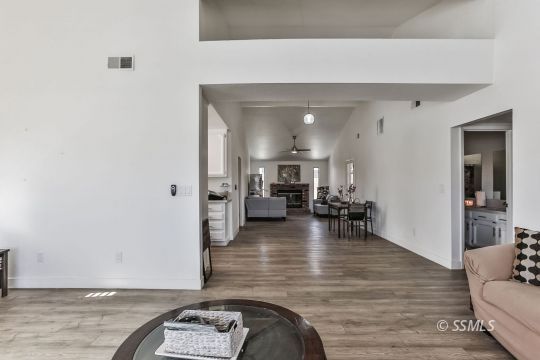 832 Walker Lane Ridgecrest, CA 93555 - Photo 6 of 23 a living room with furniture and a wooden floor