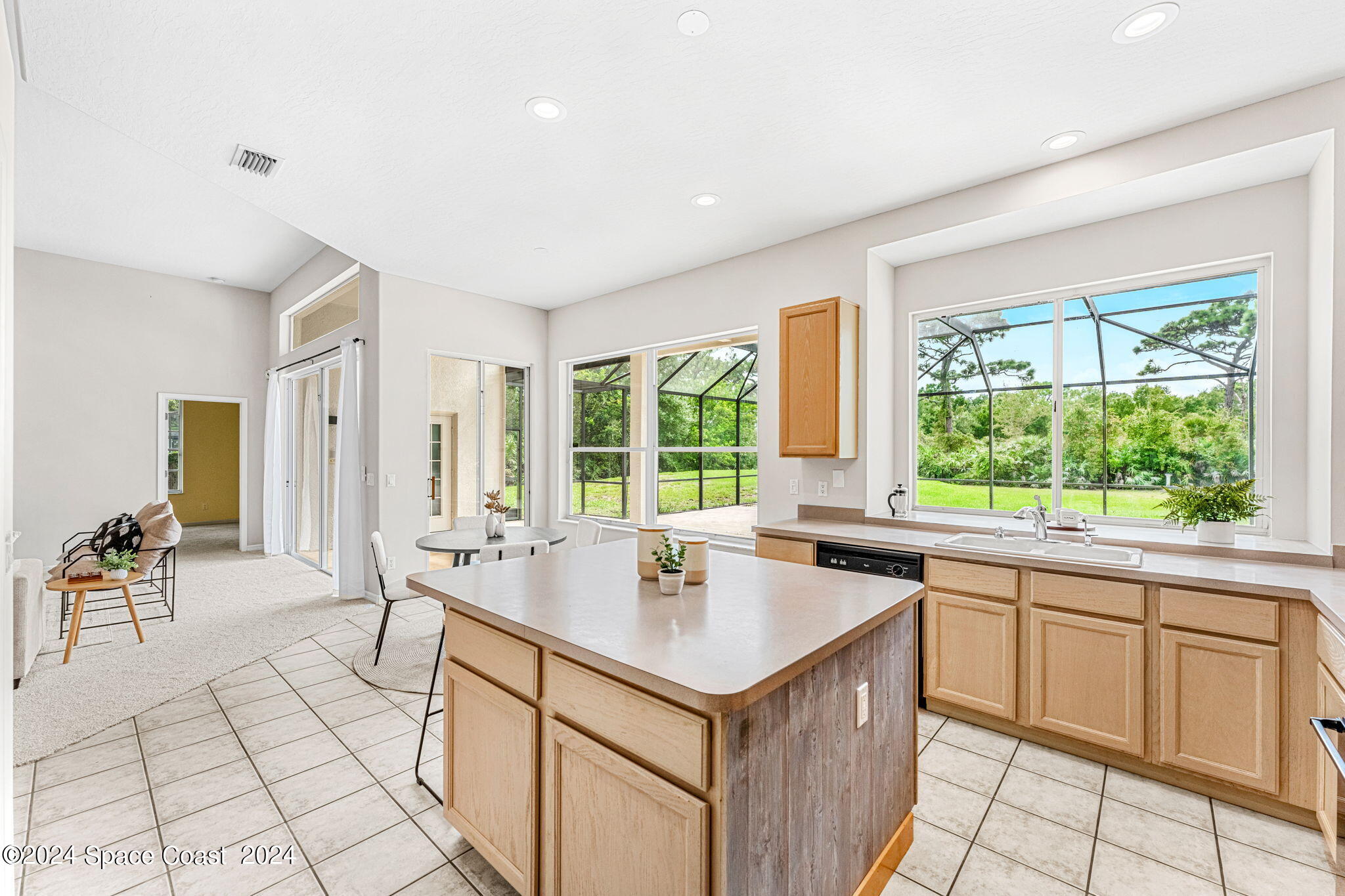 4140 Windover Way Melbourne, FL 32934 - Photo 17 of 53 a kitchen with a sink and chairs