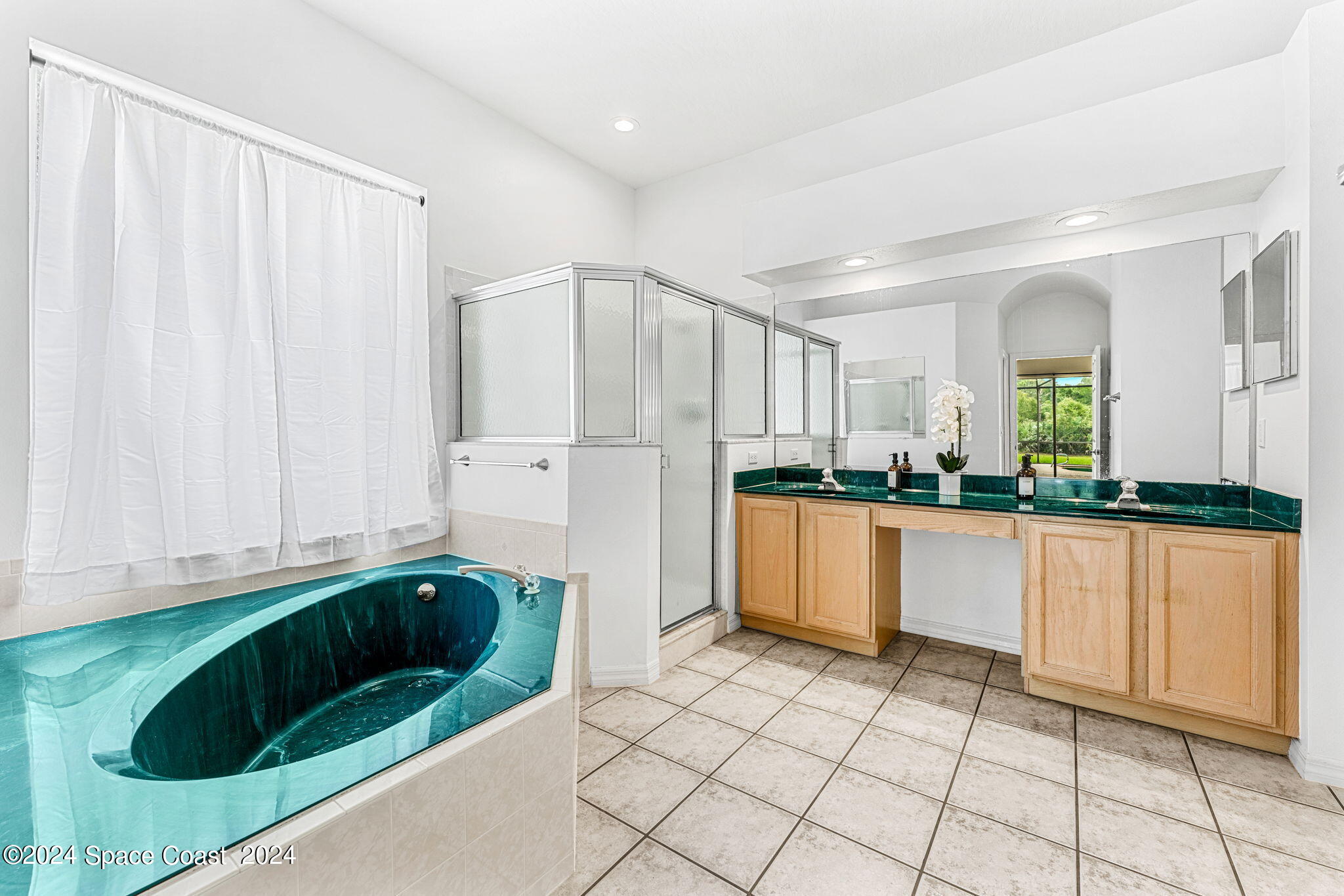 4140 Windover Way Melbourne, FL 32934 - Photo 20 of 53 a kitchen with stainless steel appliances kitchen island granite countertop a refrigerator and a sink