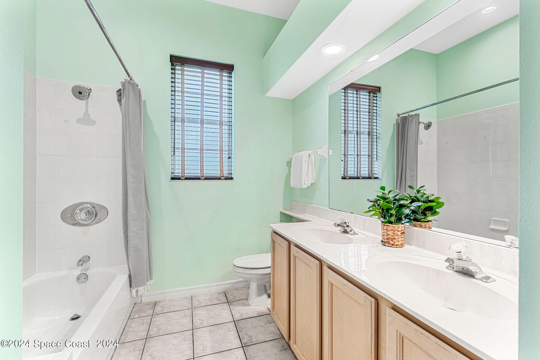 4140 Windover Way Melbourne, FL 32934 - Photo 28 of 53 a bathroom with a sink a toilet and shower