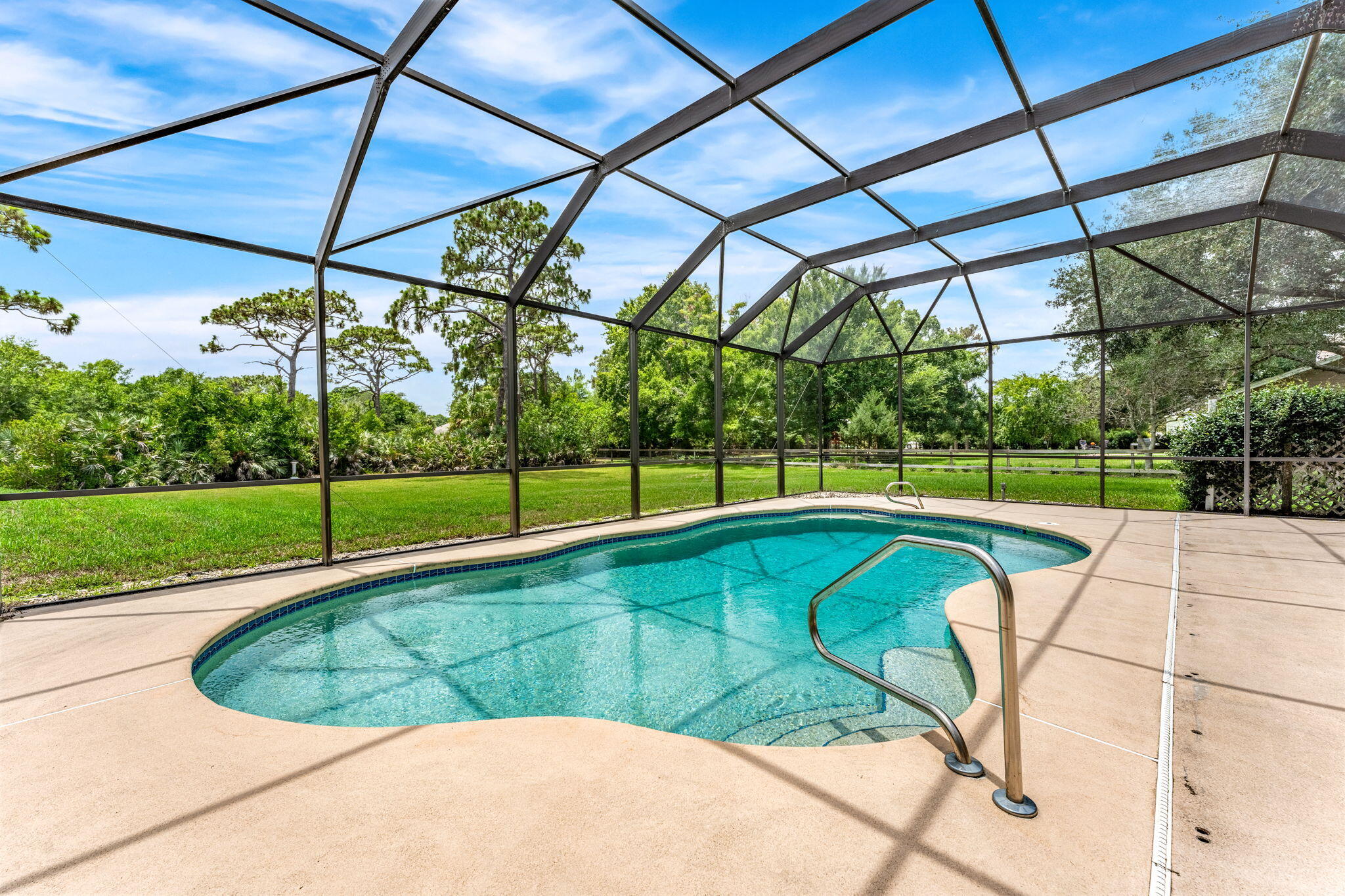 4140 Windover Way Melbourne, FL 32934 - Photo 3 of 53 a view of a backyard with a swimming pool