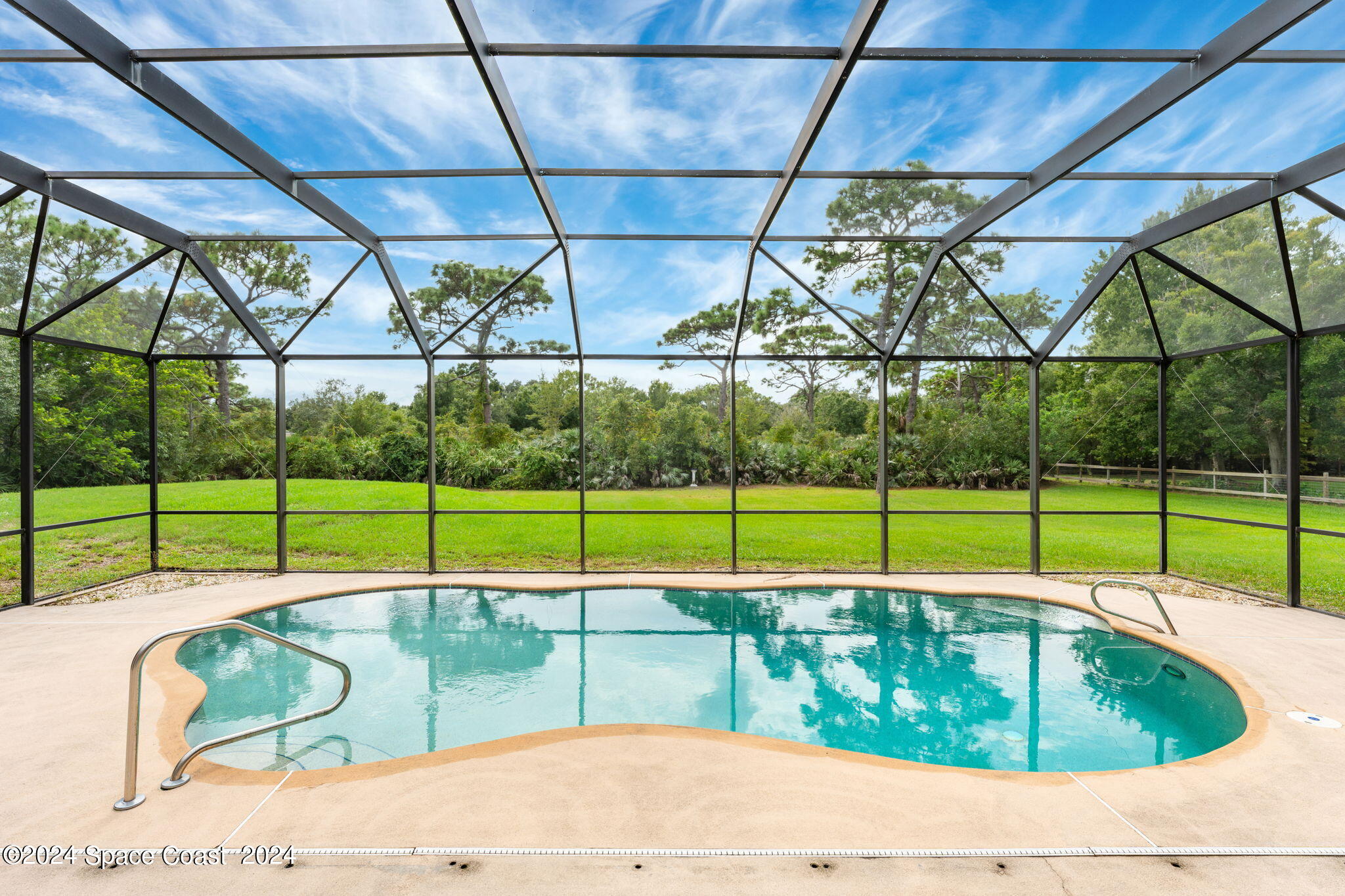 4140 Windover Way Melbourne, FL 32934 - Photo 32 of 53 a view of a backyard with a swimming pool
