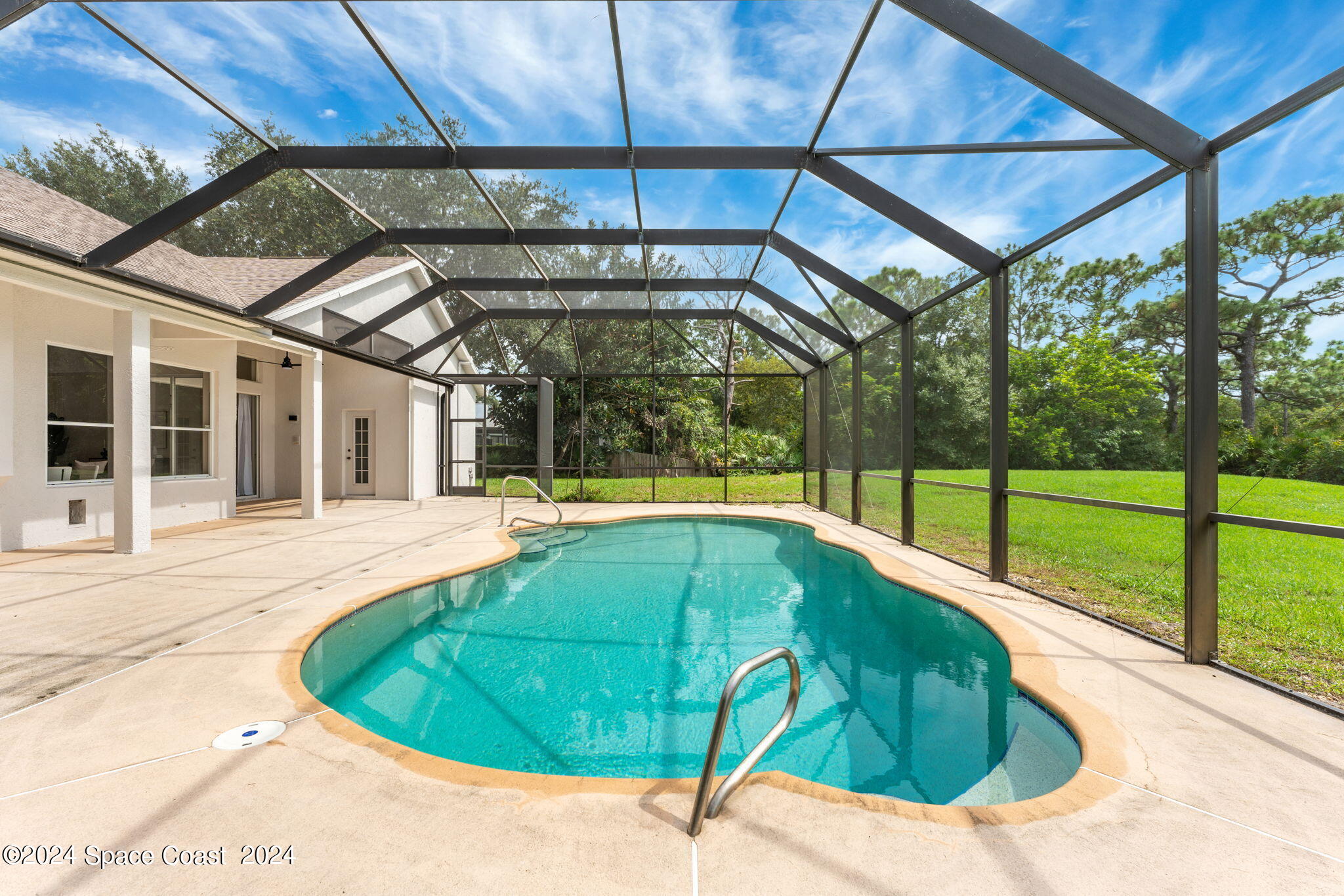 4140 Windover Way Melbourne, FL 32934 - Photo 34 of 53 a view of a backyard with a swimming pool