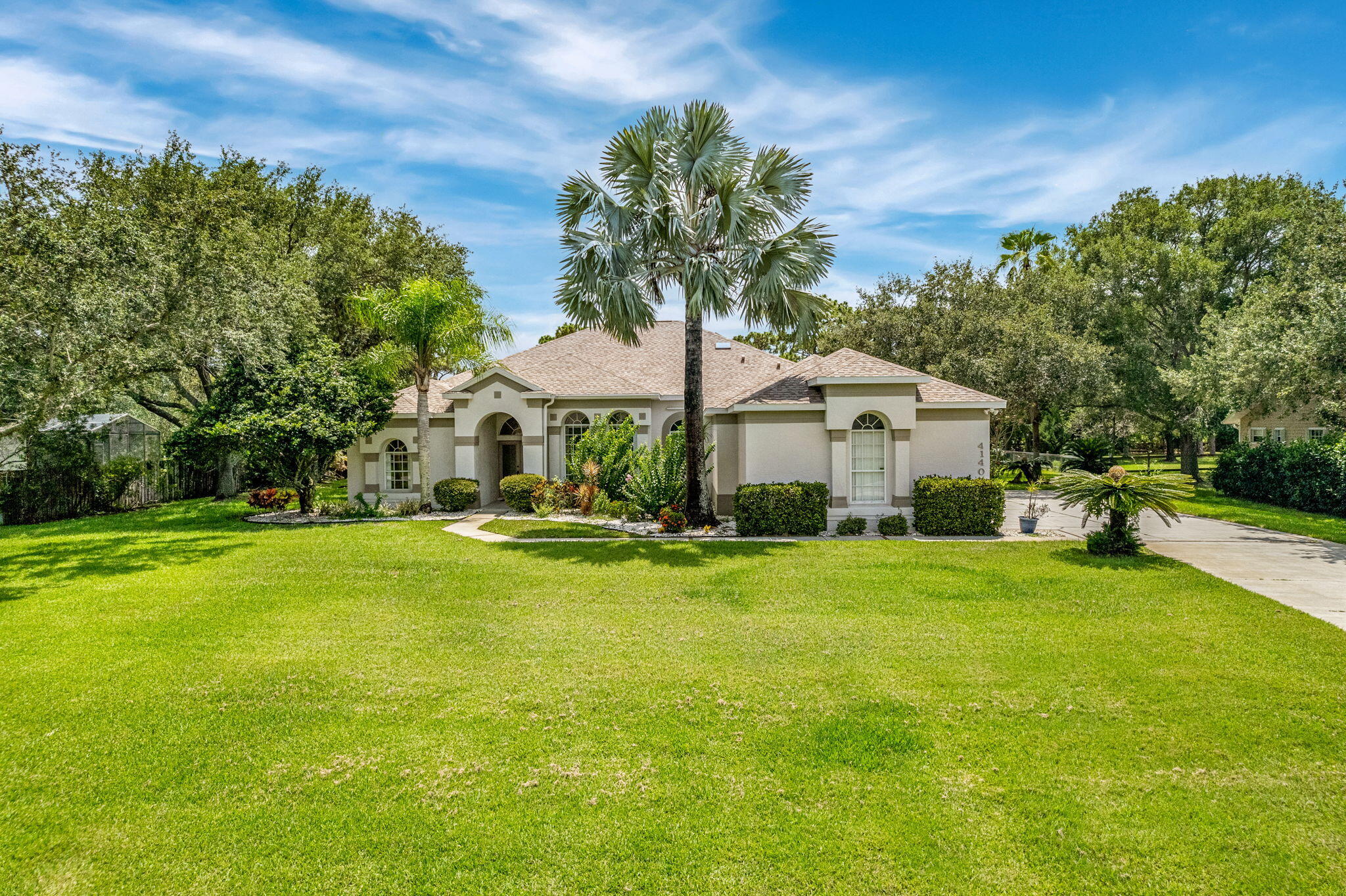 4140 Windover Way Melbourne, FL 32934 - Photo 39 of 53 a front view of a house with swimming pool having outdoor seating