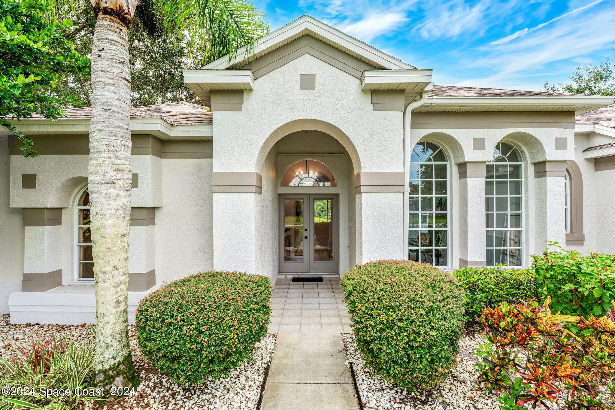 4140 Windover Way Melbourne, FL 32934 - Photo 42 of 53 a front view of a house with garden