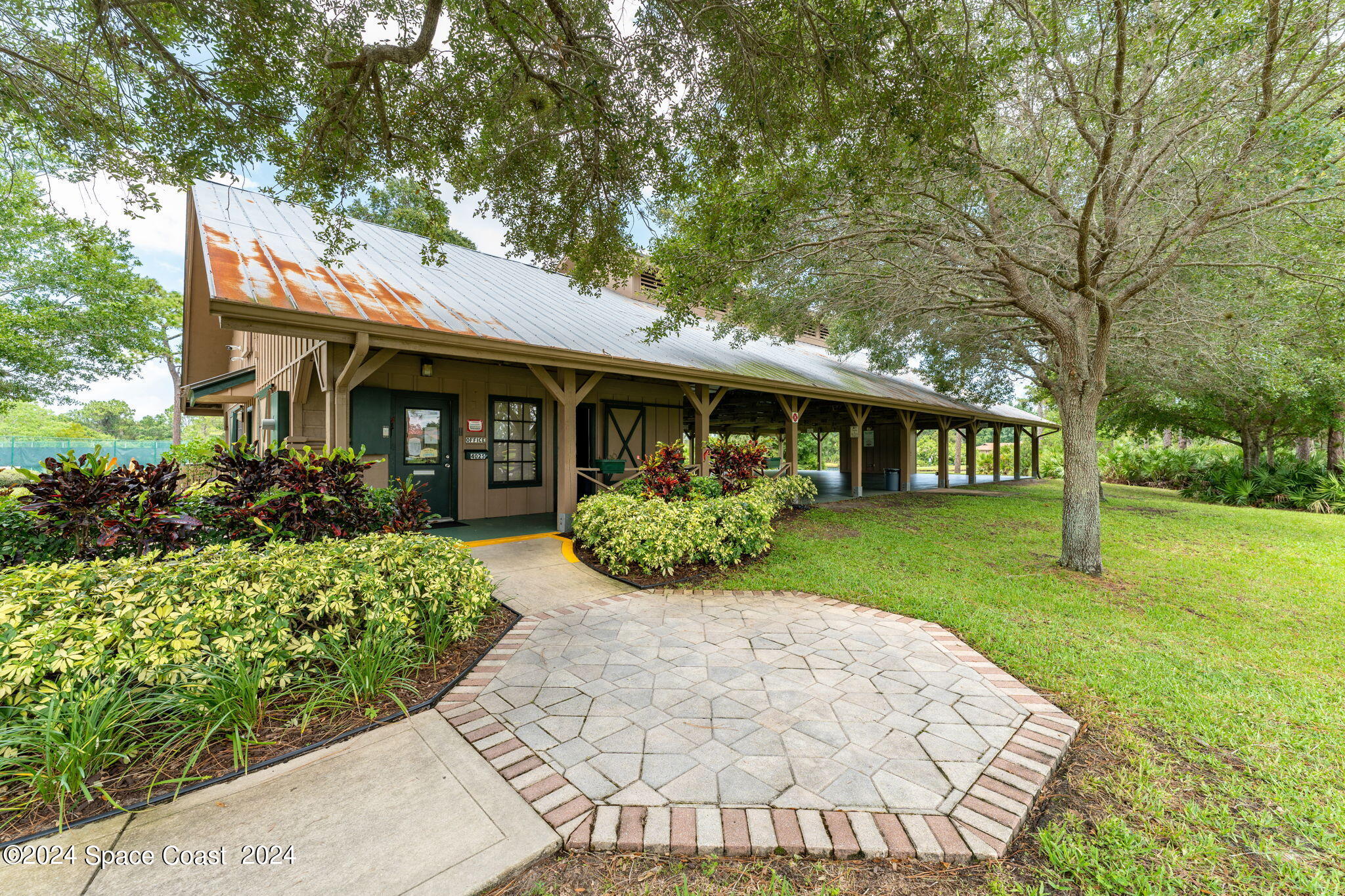 4140 Windover Way Melbourne, FL 32934 - Photo 52 of 53 a front view of a house with garden
