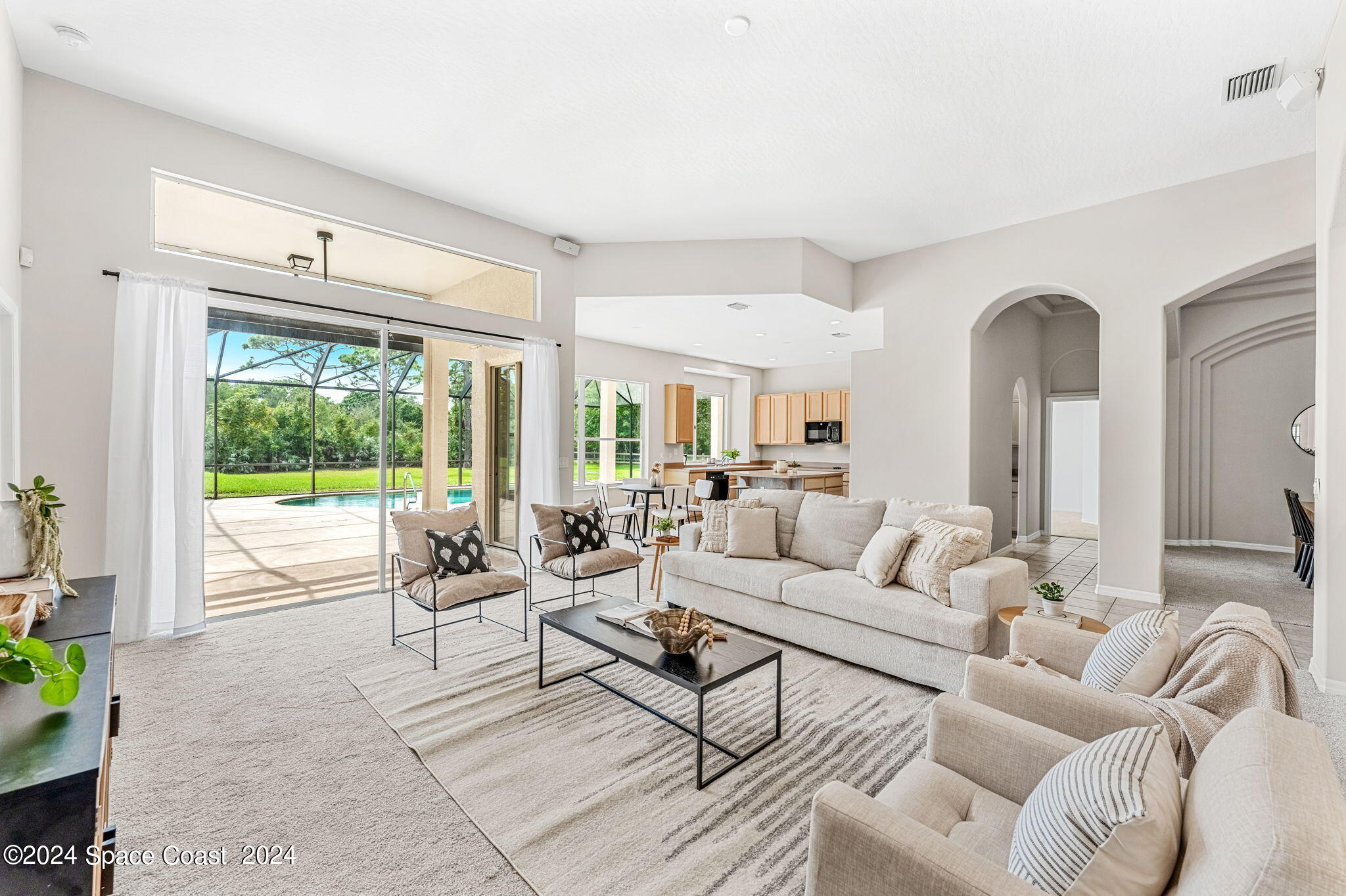 4140 Windover Way Melbourne, FL 32934 - Photo 7 of 53 a living room with furniture and a large window