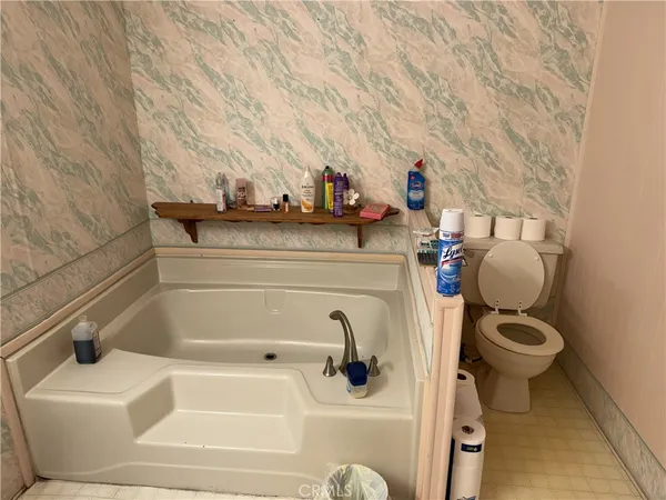 a bathroom with a sink and toilet
