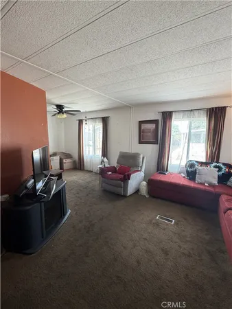 a spacious bedroom with a bed and a couch