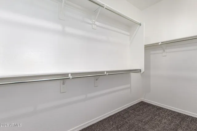 a view of an empty walk in closet