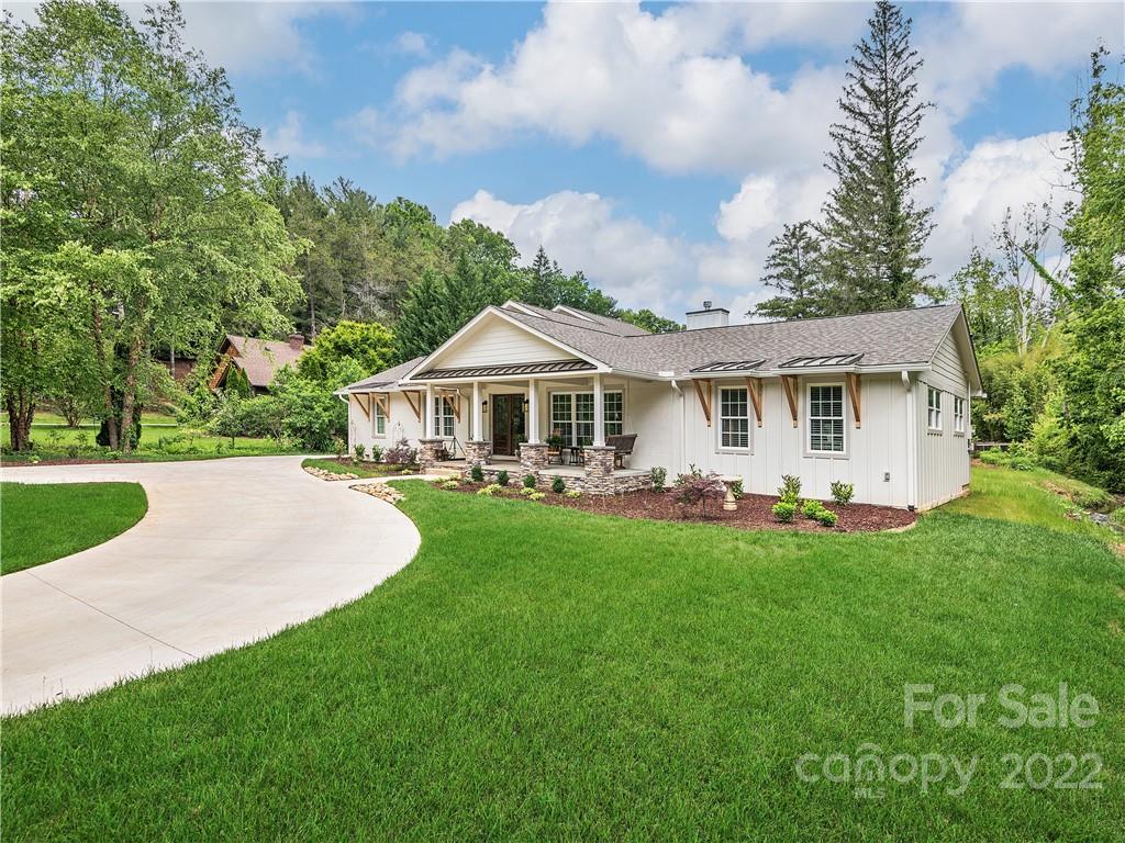 1 Inglewood Road Asheville, NC 28804 - Photo 1 of 40 a front view of a house with yard patio and green space