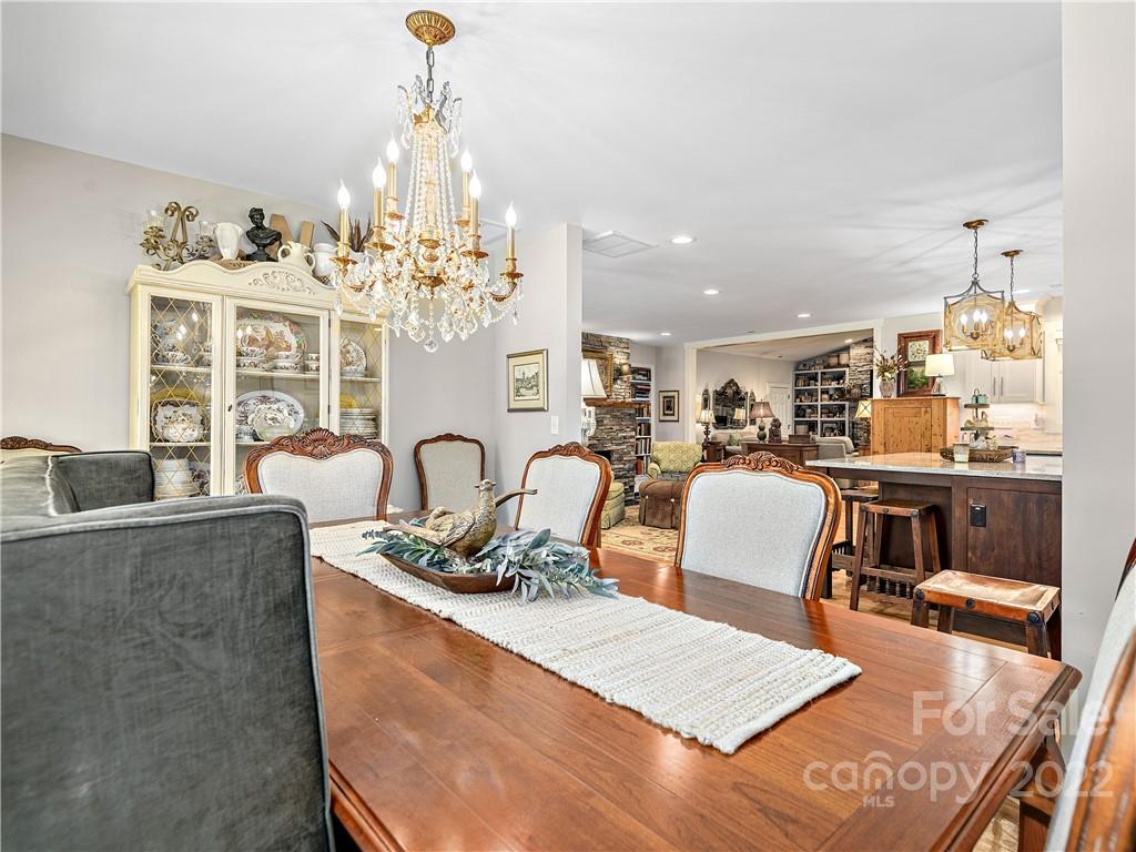 1 Inglewood Road Asheville, NC 28804 - Photo 12 of 40 a living room with furniture a chandelier and kitchen view