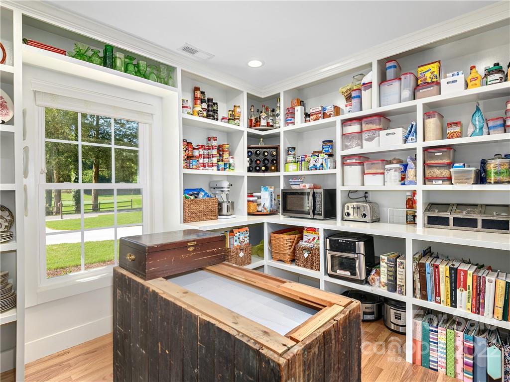 1 Inglewood Road Asheville, NC 28804 - Photo 16 of 40 a living room with furniture and a book shelf