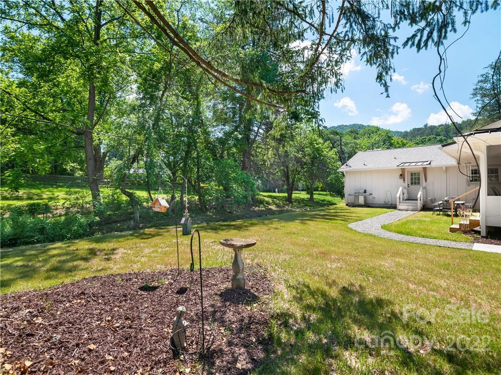 1 Inglewood Road Asheville, NC 28804 - Photo 6 of 40 a view of a swimming pool with a yard