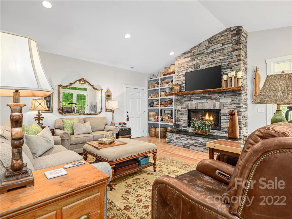 1 Inglewood Road Asheville, NC 28804 - Photo 8 of 40 a living room with furniture fireplace and a flat screen tv