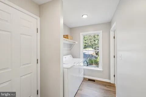 a bathroom with a window a sink and a window