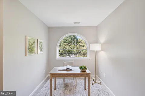 a workspace with furniture and window