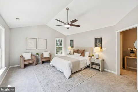 a bedroom with bed and window