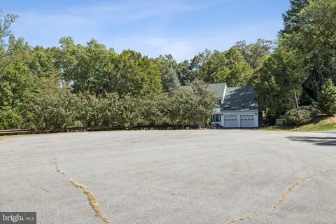 a tall building with trees in the background