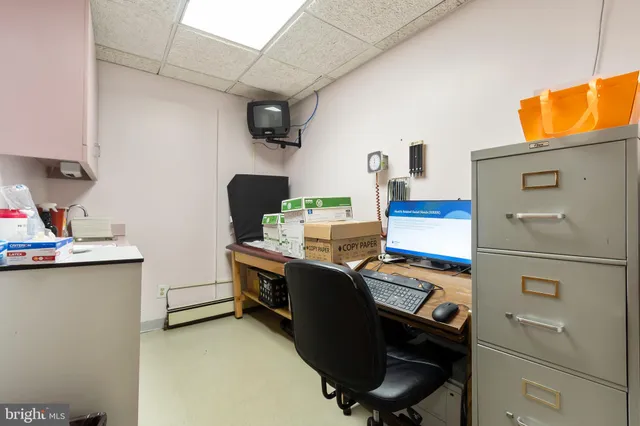 a bedroom with furniture and a chair