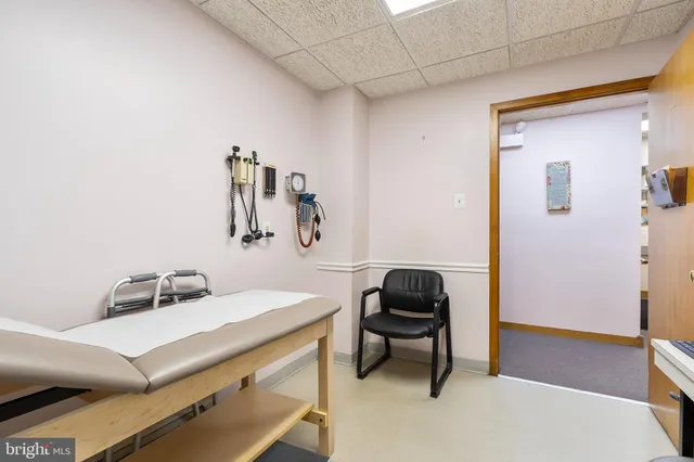 a view of a workspace with furniture