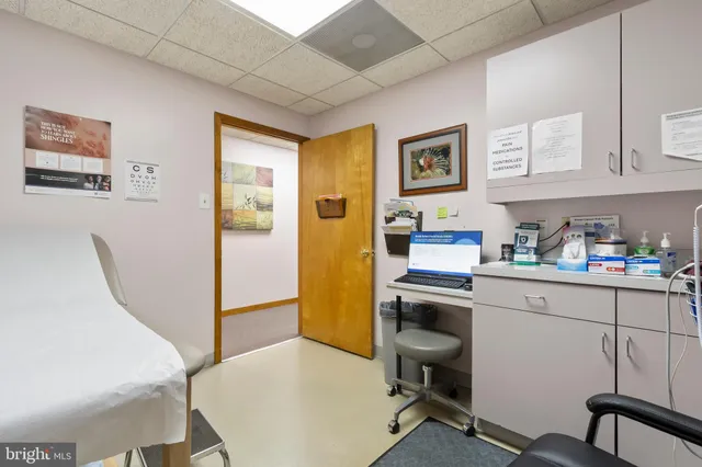 a view of a workspace with furniture