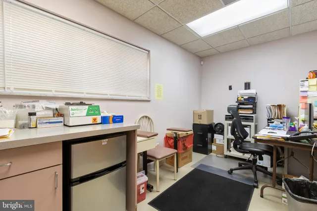 a bedroom with furniture and a flat screen tv