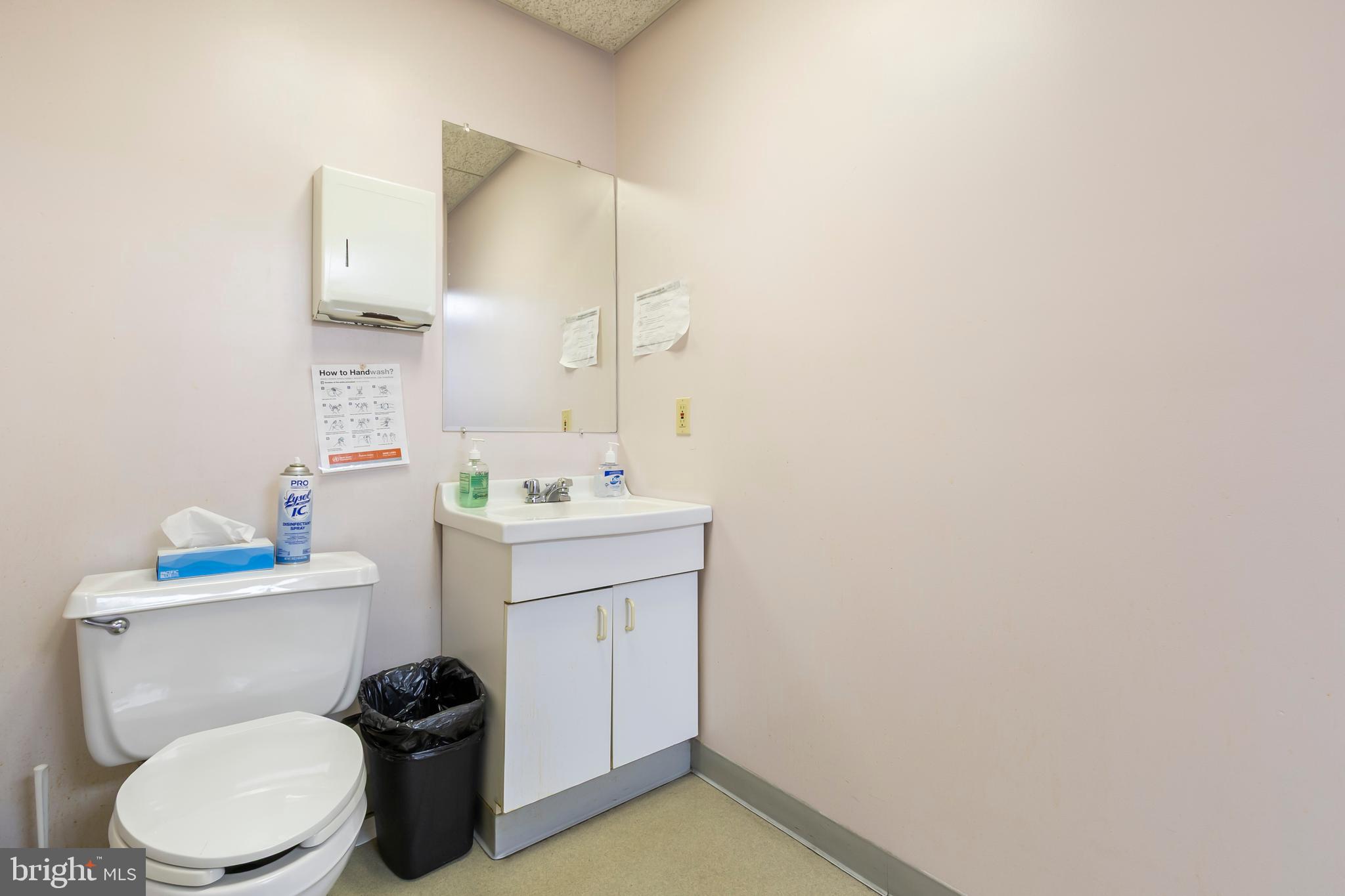 1816-18 East Passyunk Avenue Philadelphia, PA 19148 - Photo 30 of 58 a bathroom with a sink mirror vanity and toilet