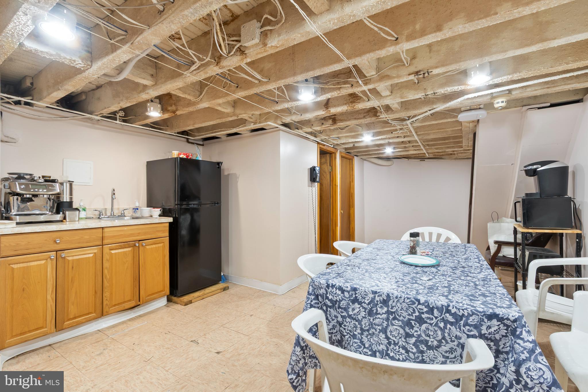 1816-18 East Passyunk Avenue Philadelphia, PA 19148 - Photo 37 of 58 a room with stainless steel appliances kitchen island granite countertop a sink and cabinets