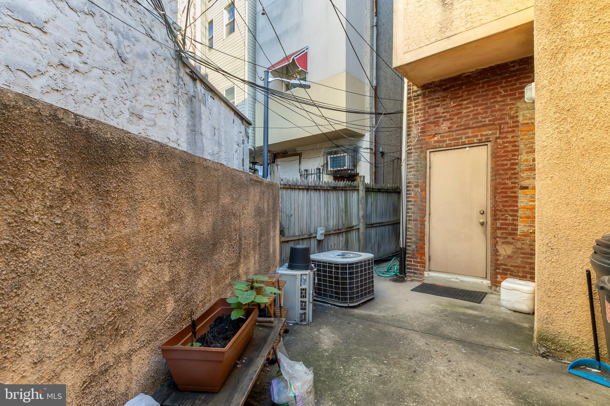 1816-18 East Passyunk Avenue Philadelphia, PA 19148 - Photo 45 of 58 a backyard of a house with outdoor seating