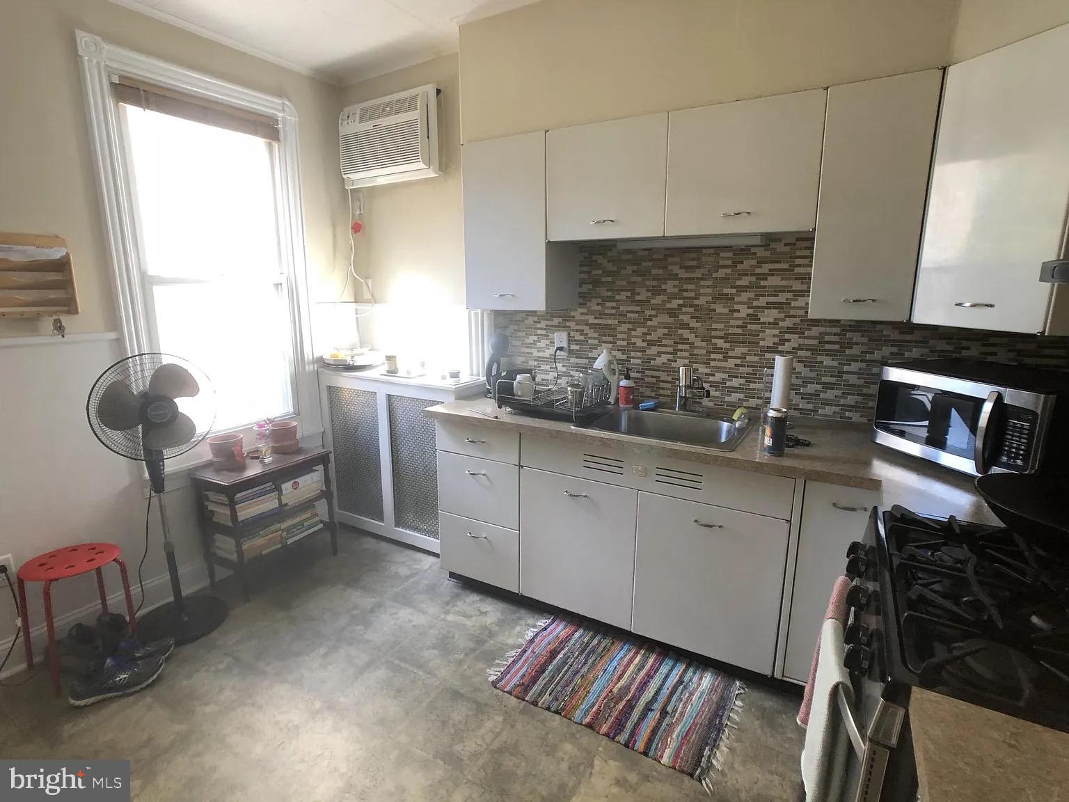 1816-18 East Passyunk Avenue Philadelphia, PA 19148 - Photo 47 of 58 a kitchen with a sink and cabinets