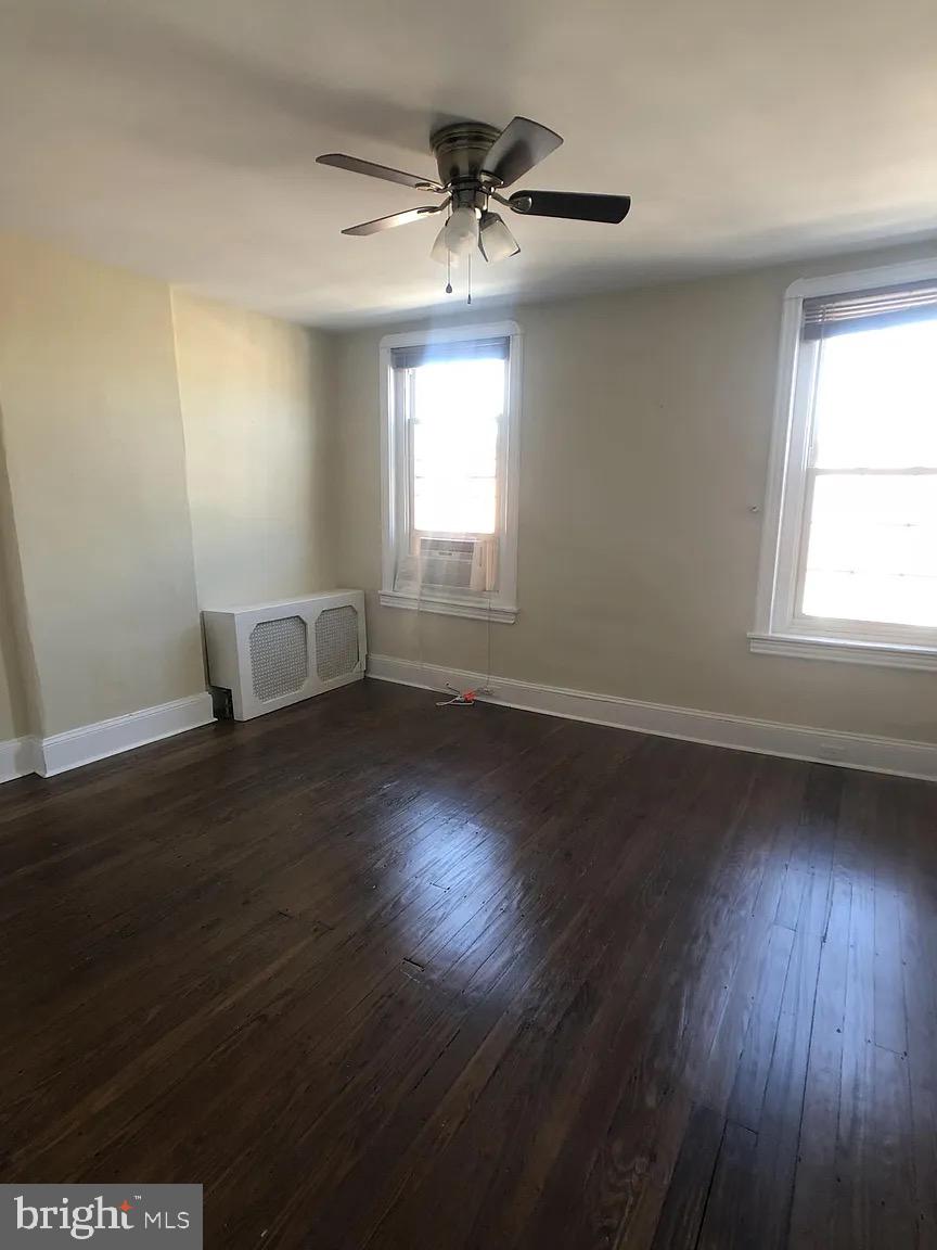 1816-18 East Passyunk Avenue Philadelphia, PA 19148 - Photo 52 of 58 an empty room with wooden floor and windows