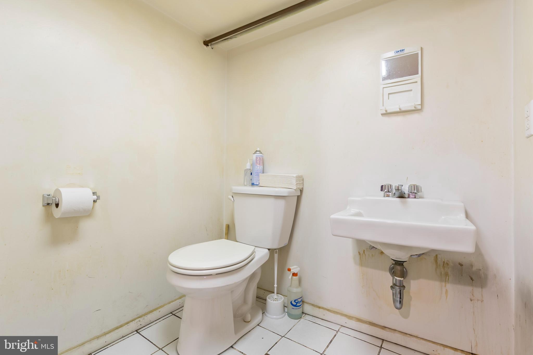 1816-18 East Passyunk Avenue Philadelphia, PA 19148 - Photo 9 of 58 a bathroom with a sink a toilet and a mirror