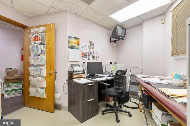 a room with a table and chairs