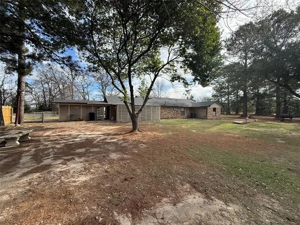 a view of a house with a big yard