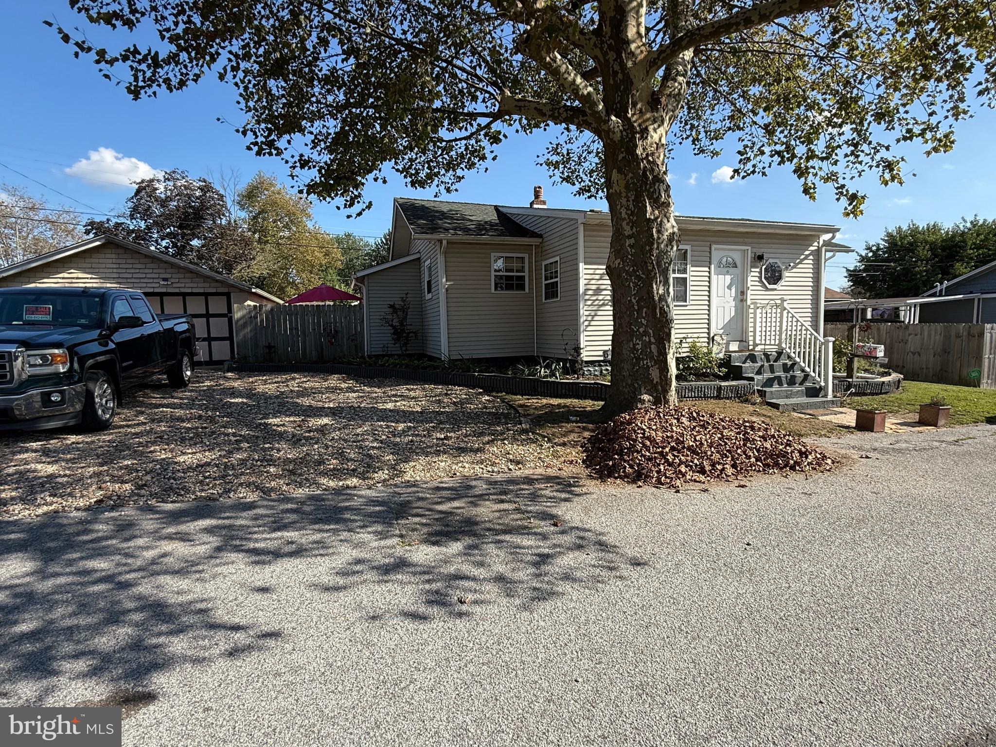 243 C Street Carneys Point, NJ 08069 - Photo 3 of 21 a front view of a house with a yard and garage