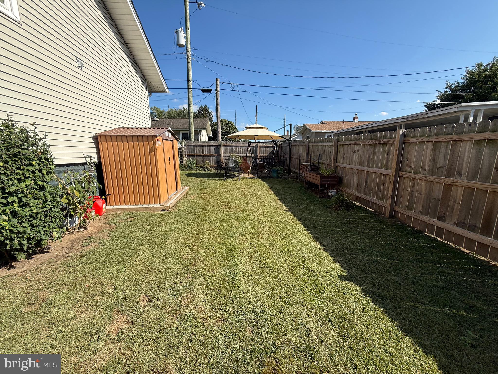 243 C Street Carneys Point, NJ 08069 - Photo 5 of 21 a view of a backyard with wooden fence