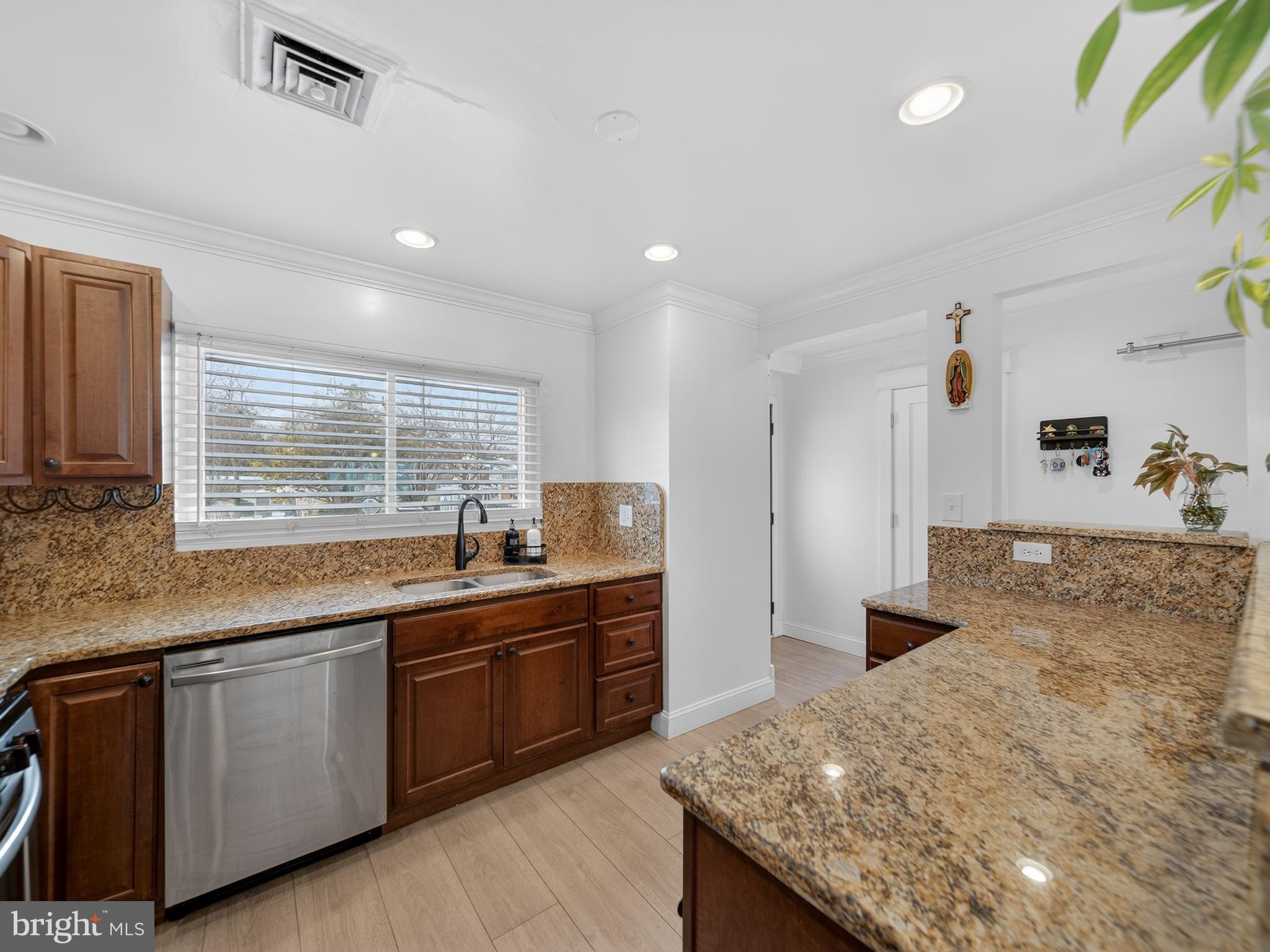 609 Cedarleaf Avenue Capitol Heights, MD 20743 - Photo 11 of 42 a kitchen with granite countertop sink and cabinets