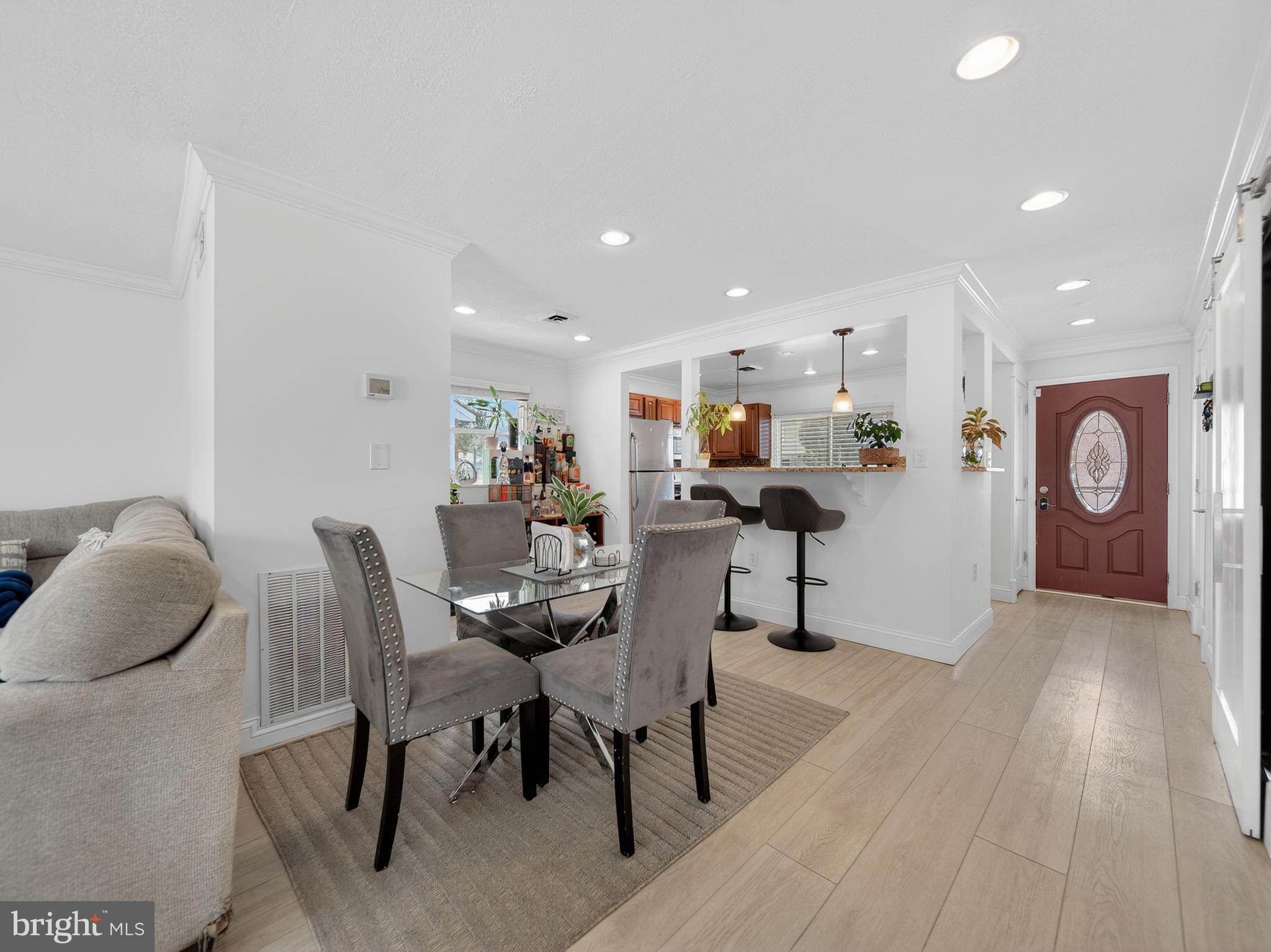 609 Cedarleaf Avenue Capitol Heights, MD 20743 - Photo 17 of 42 a view of a dining room with furniture and wooden floor