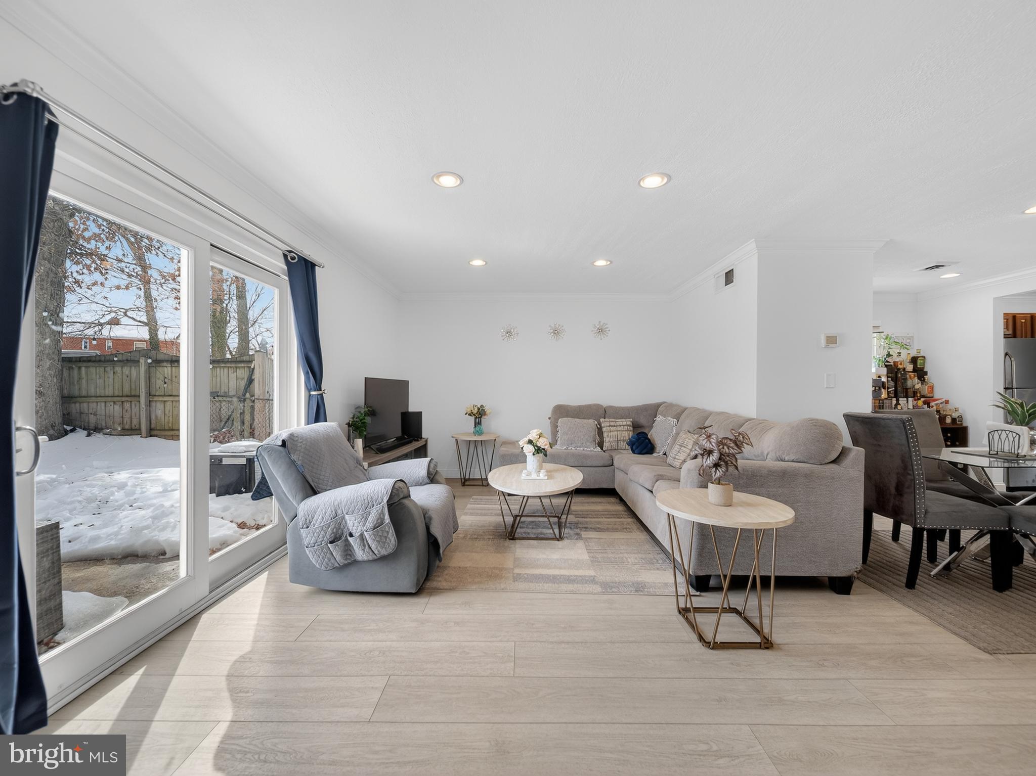 609 Cedarleaf Avenue Capitol Heights, MD 20743 - Photo 19 of 42 a living room with furniture and a large window