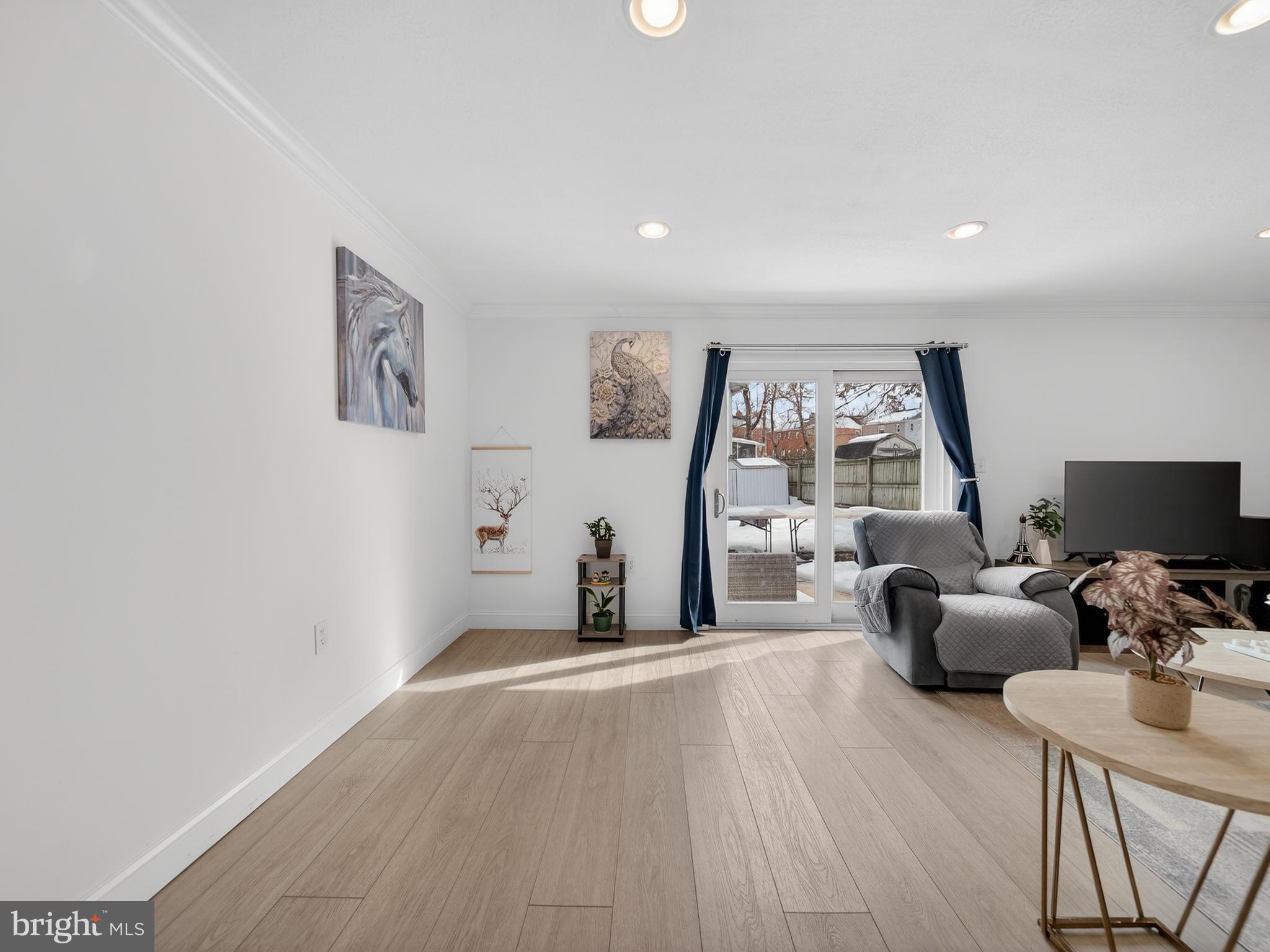 609 Cedarleaf Avenue Capitol Heights, MD 20743 - Photo 23 of 42 a view of a livingroom with furniture and a flat screen tv