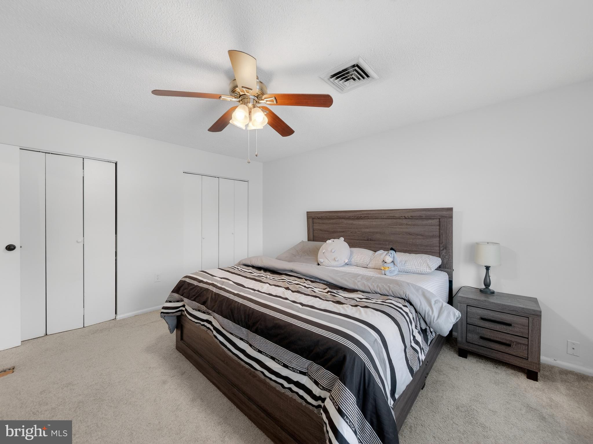 609 Cedarleaf Avenue Capitol Heights, MD 20743 - Photo 29 of 42 a bedroom with a bed and a chandelier