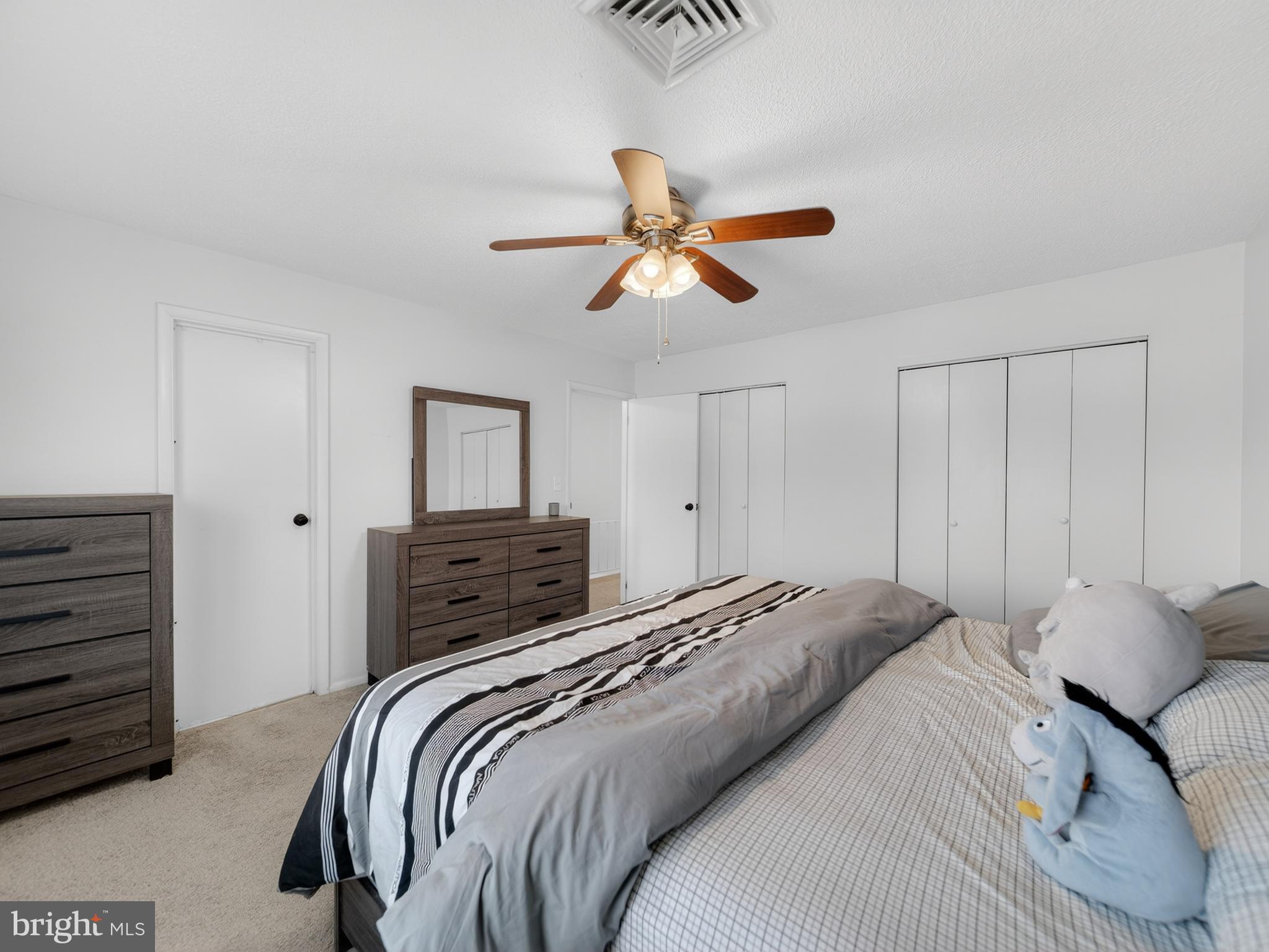 609 Cedarleaf Avenue Capitol Heights, MD 20743 - Photo 30 of 42 a bedroom with a bed and a chandelier