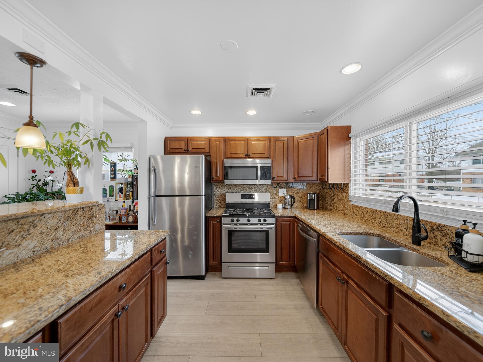 609 Cedarleaf Avenue Capitol Heights, MD 20743 - Photo 3 of 42 a kitchen with stainless steel appliances granite countertop a sink stove and refrigerator