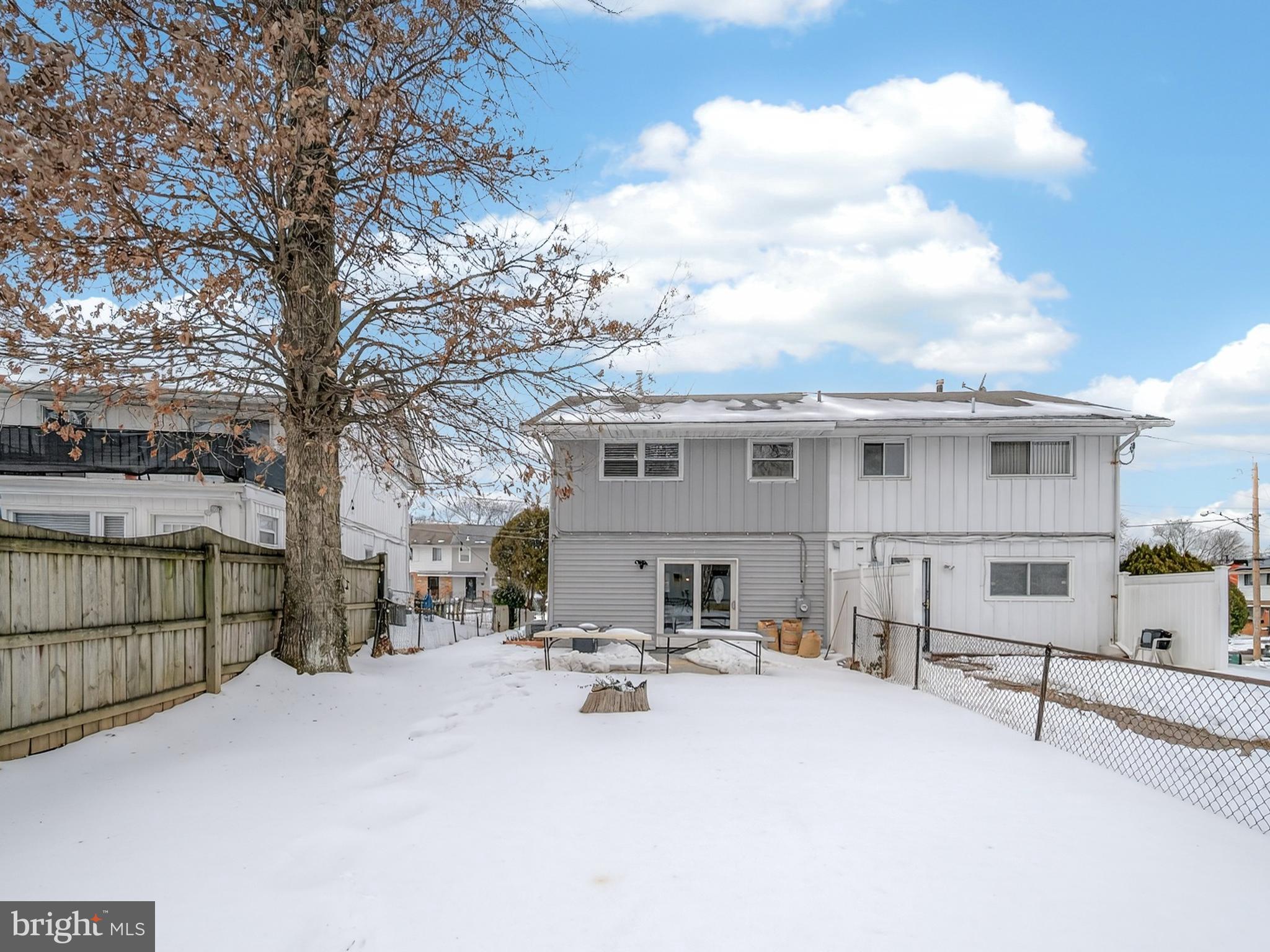 609 Cedarleaf Avenue Capitol Heights, MD 20743 - Photo 40 of 42 a view of a white house with a yard and sitting area