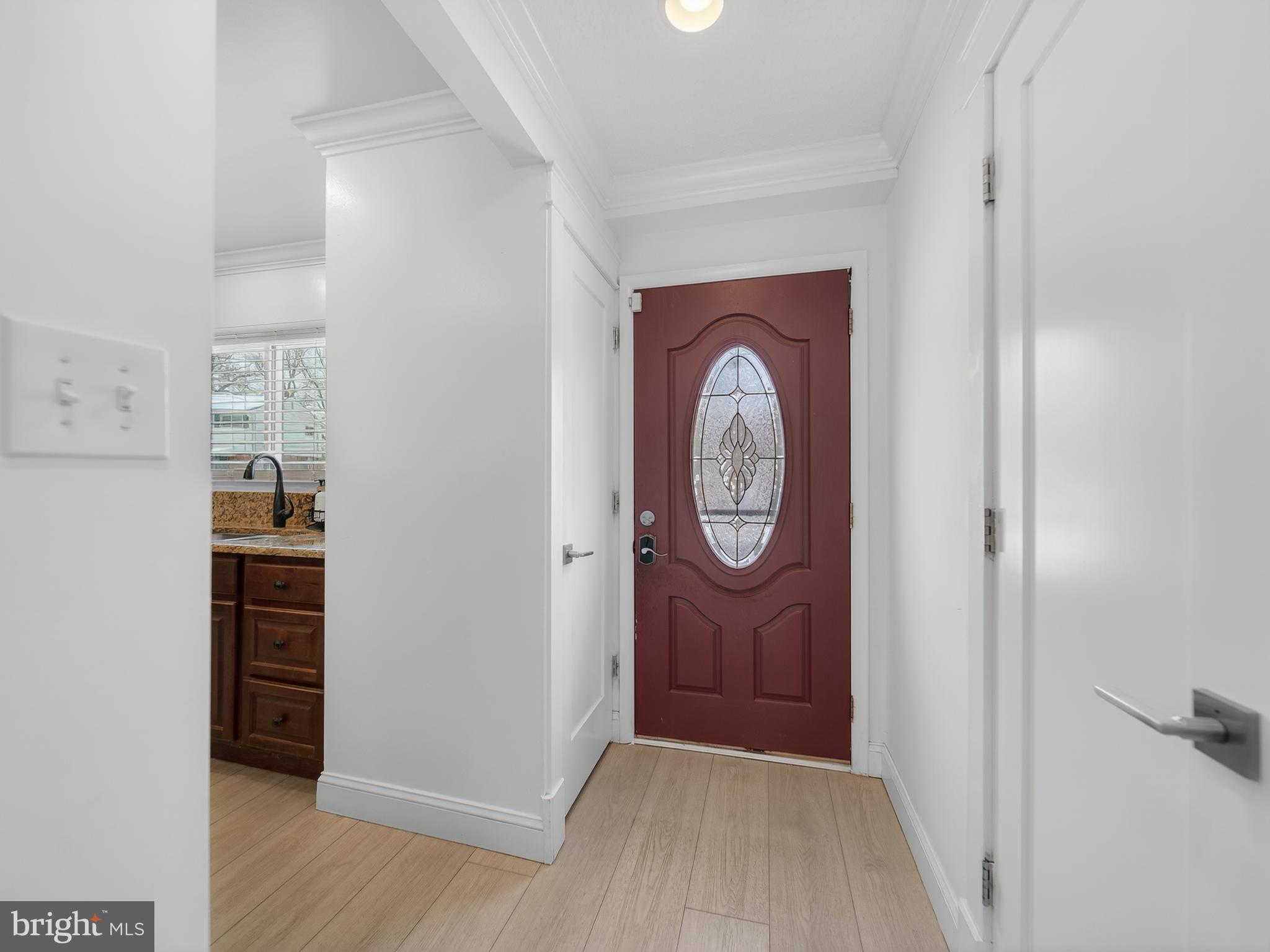 609 Cedarleaf Avenue Capitol Heights, MD 20743 - Photo 7 of 42 a view of a hallway with wooden floor