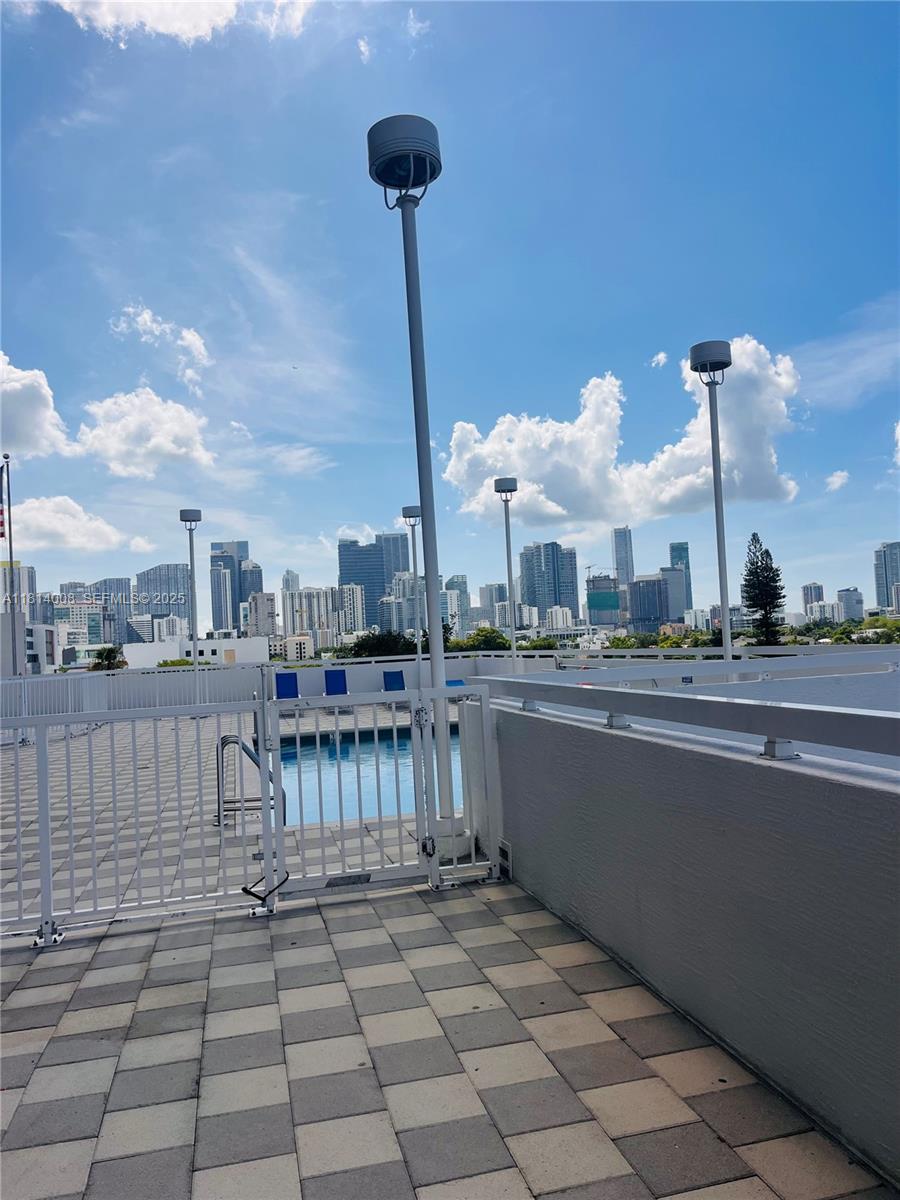 900 Southwest 8th Street, Unit 806 Miami, FL 33130 - Photo 14 of 22 a view of a terrace with sitting area